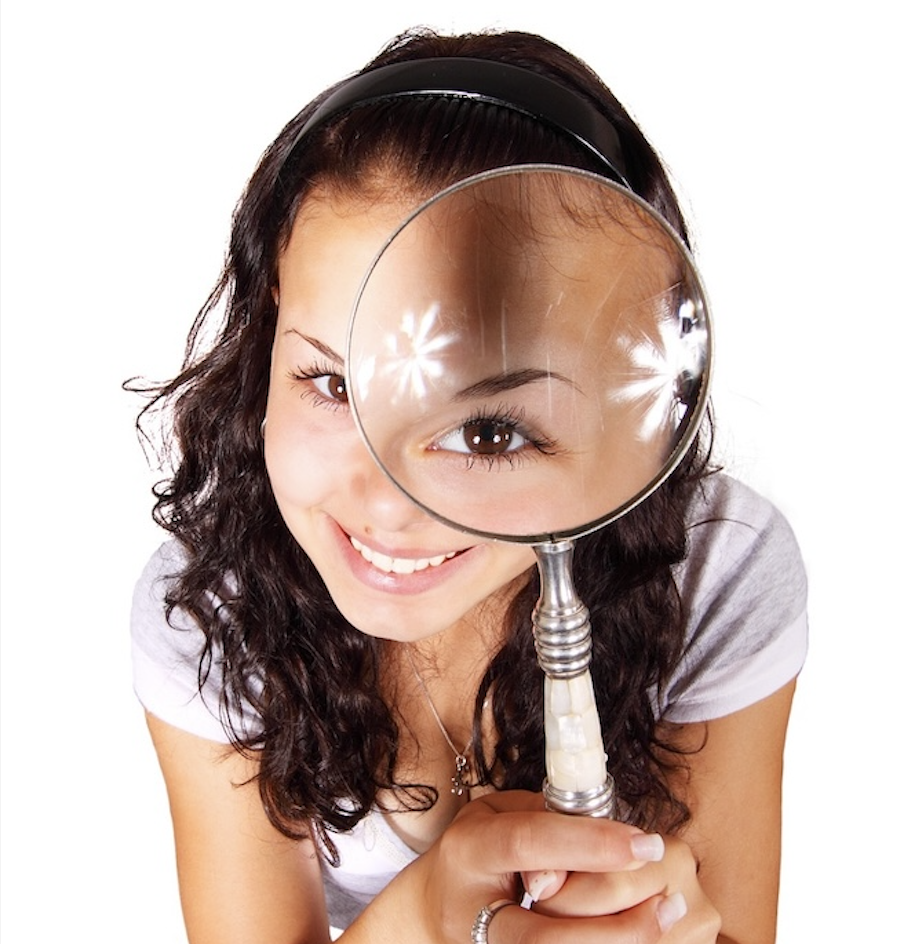 Looking through a magnifying glass.