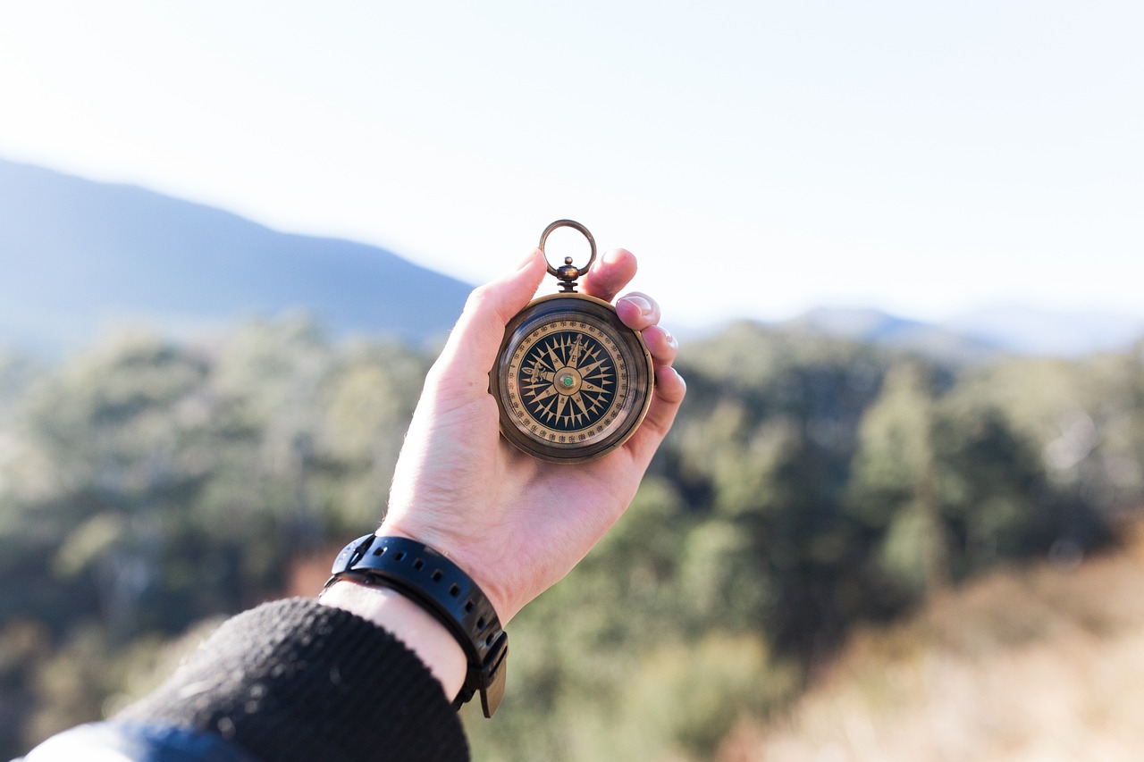 Holding a compass in nature