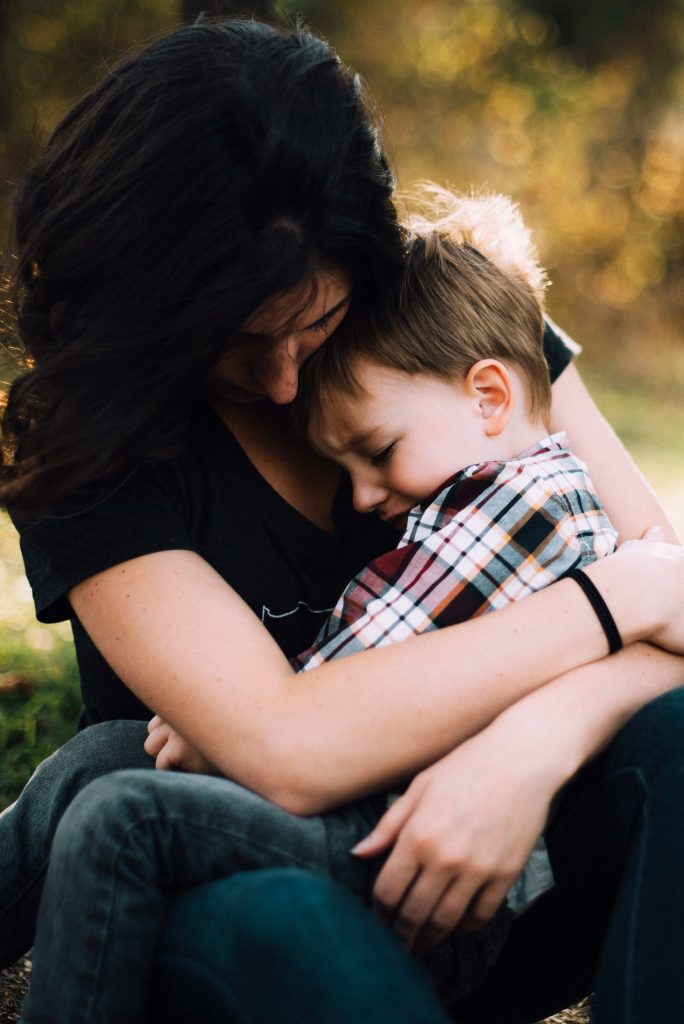 Parent comforting her child